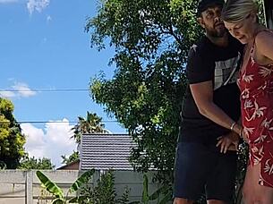 the blonde babe has an outdoor quickie but gets caught by the neighbor peeking over the wall.