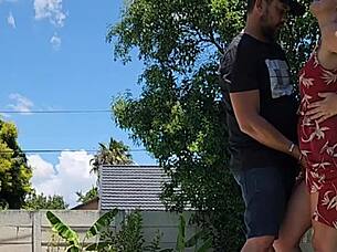 the blonde babe has an outdoor quickie but gets caught by the neighbor peeking over the wall.