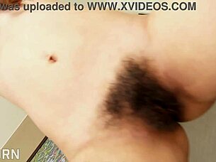 sexy asian thai girl teases her hairy pussy with a vibrator, hinting at more.
