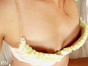 sexy asian thai girl teases her hairy pussy with a vibrator, hinting at more.