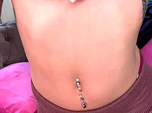 Is Luna Luxe masturbating with her pink vibrator on the sofa?