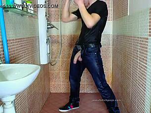 Gay guy indulges in shower fetish with jeans and dick
