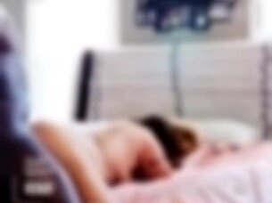 Frankie performs a hot striptease in stockings and heels.