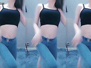 cute chinese girl dances with seductive hip shakes in steamy video