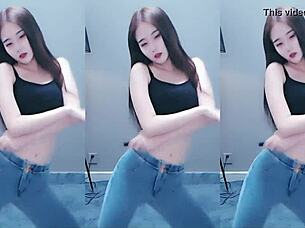 cute chinese girl dances with seductive hip shakes in steamy video