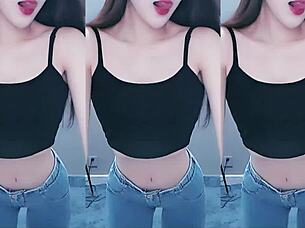 cute chinese girl dances with seductive hip shakes in steamy video