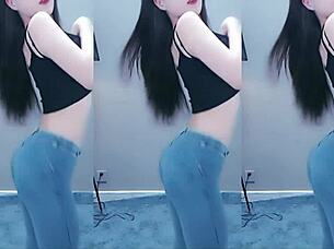 cute chinese girl dances with seductive hip shakes in steamy video