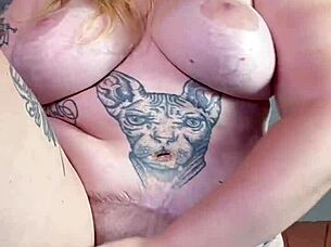 She fingers her hairy pussy.