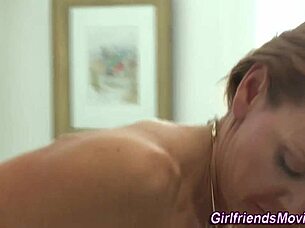 milf and babe sharing a kiss