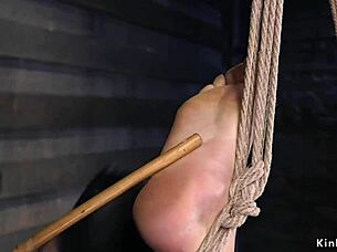 Tied up brunette toyed in dungeon, rough and bizarre