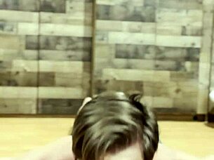 muscular bodybuilder stretching his sexy muscles in the gym